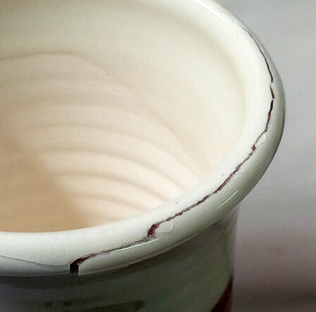 Glaze over engobe shivering on mug lip