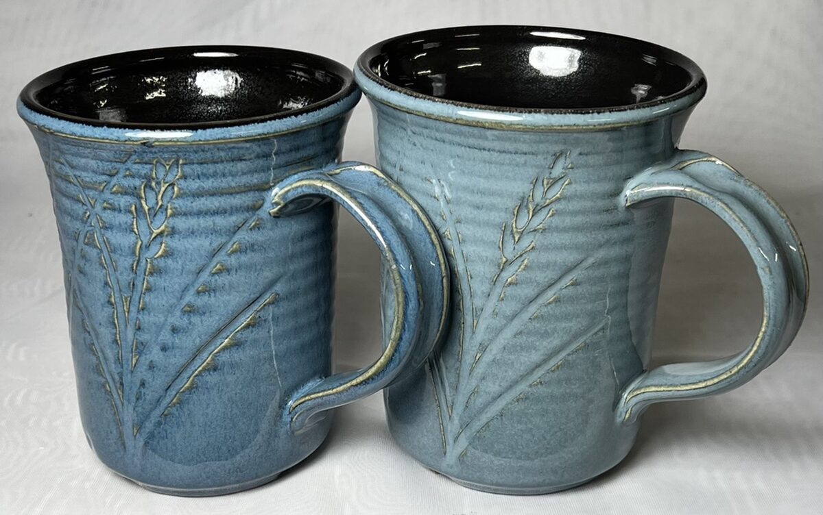 Two floating blue mugs