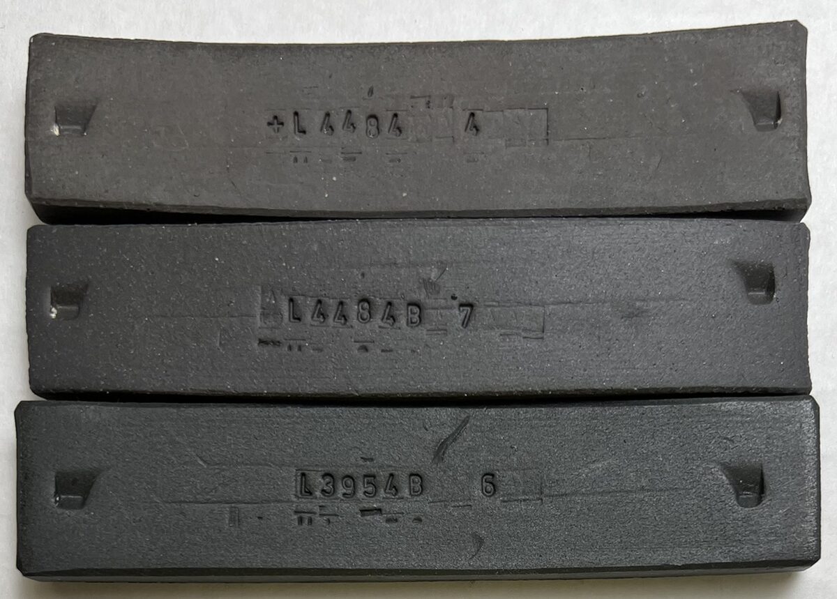 3 black porcelain fired test bars