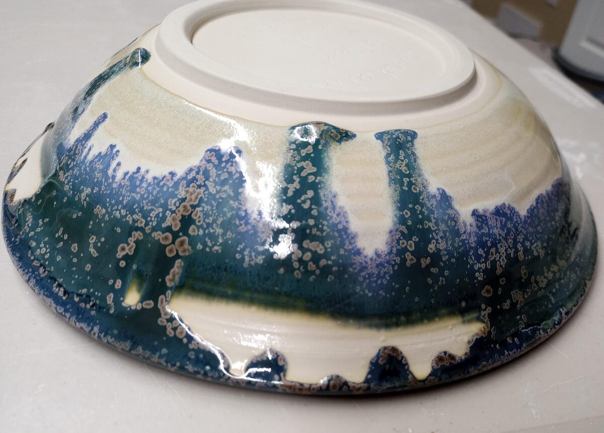 Dipping glaze crawling because of layering