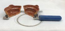 A terra cotta dish has been cut in half using a hand diamond saw