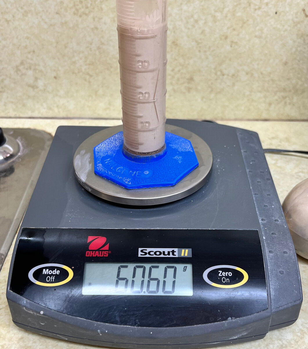 Slurry in graduated cylinder