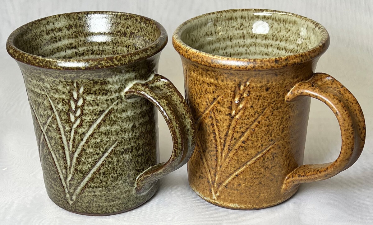 Two cone 10R speckled mugs