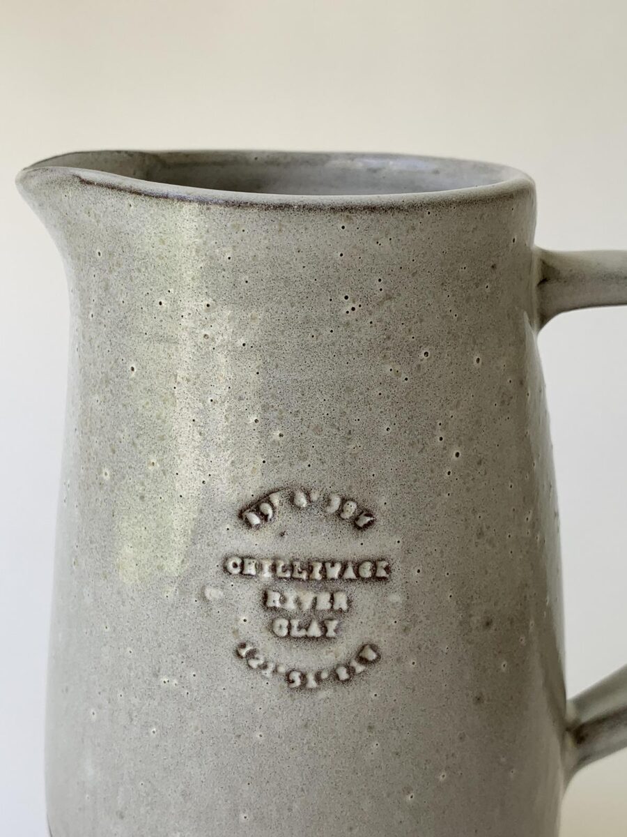A terra cotta vase with a thousand small glaze blisters