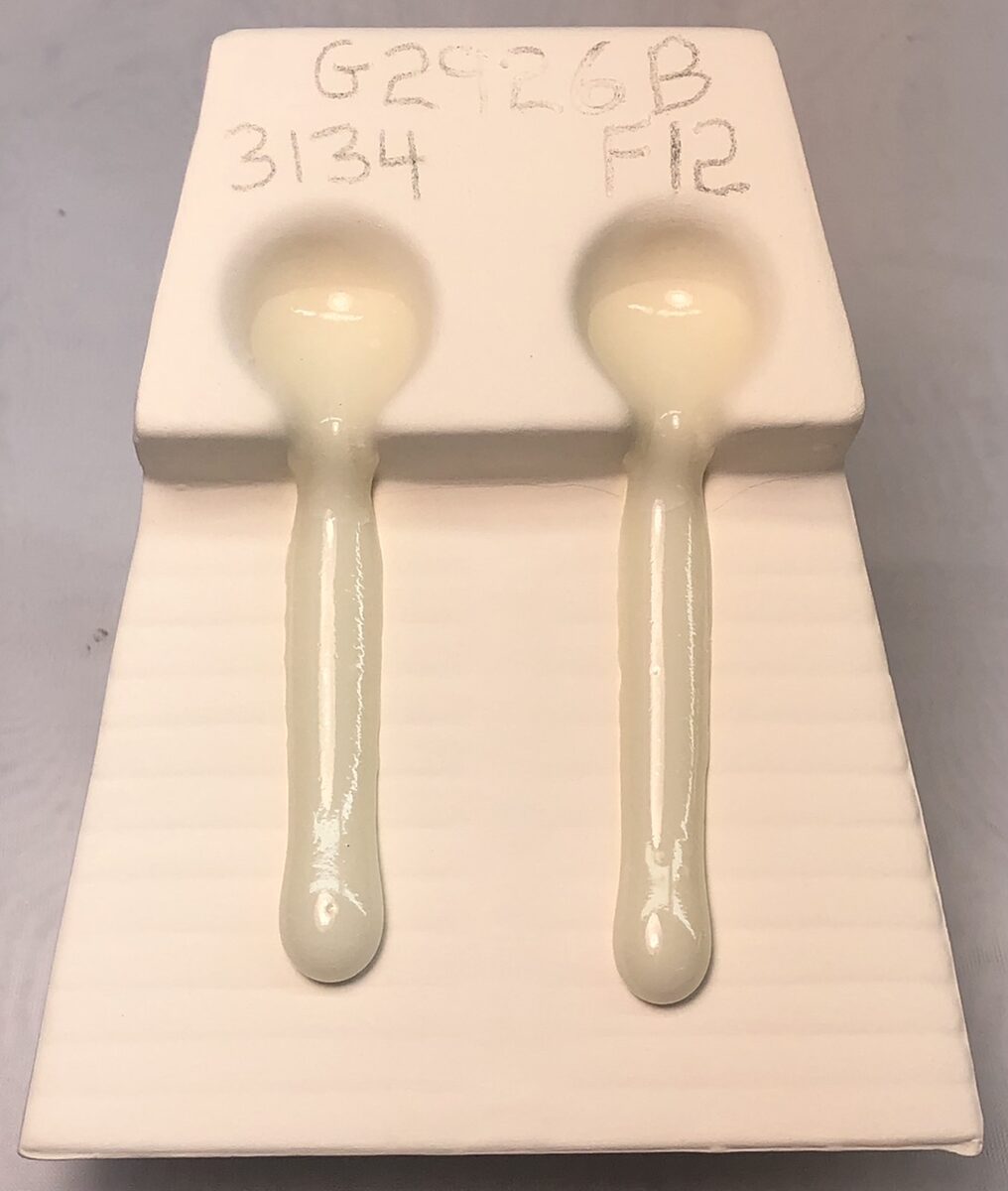 Melt fluidity tester comparing two versions of G2926B