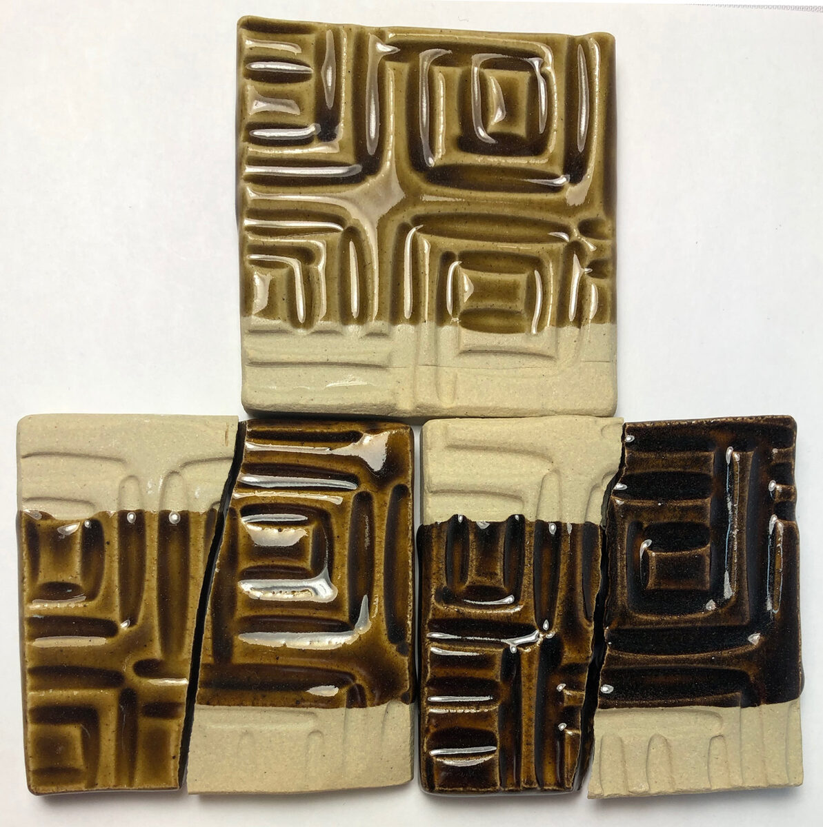 Glazed tiles showing darkening with increased iron additions to GA6-B