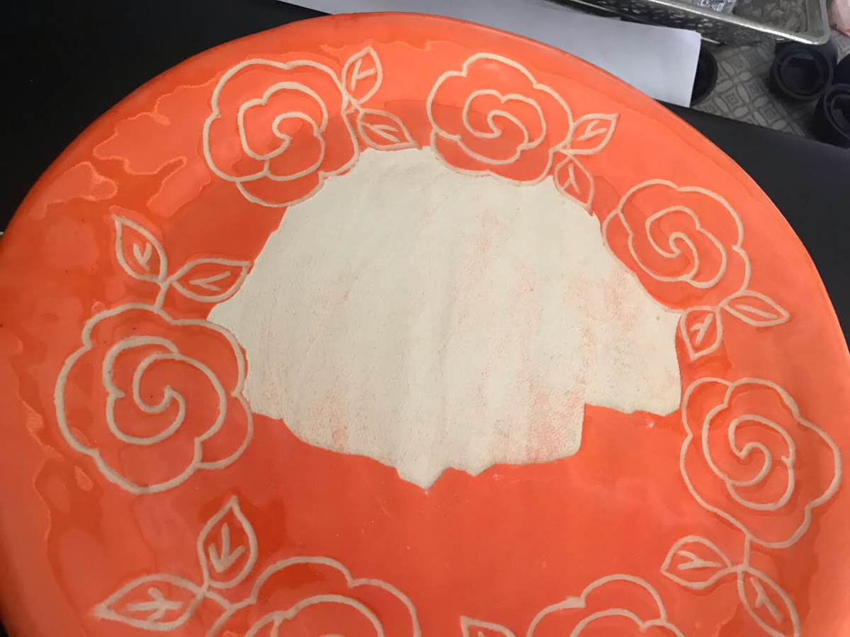Orange underglaze is flaking off