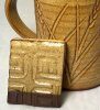 A glazed test tile and mug