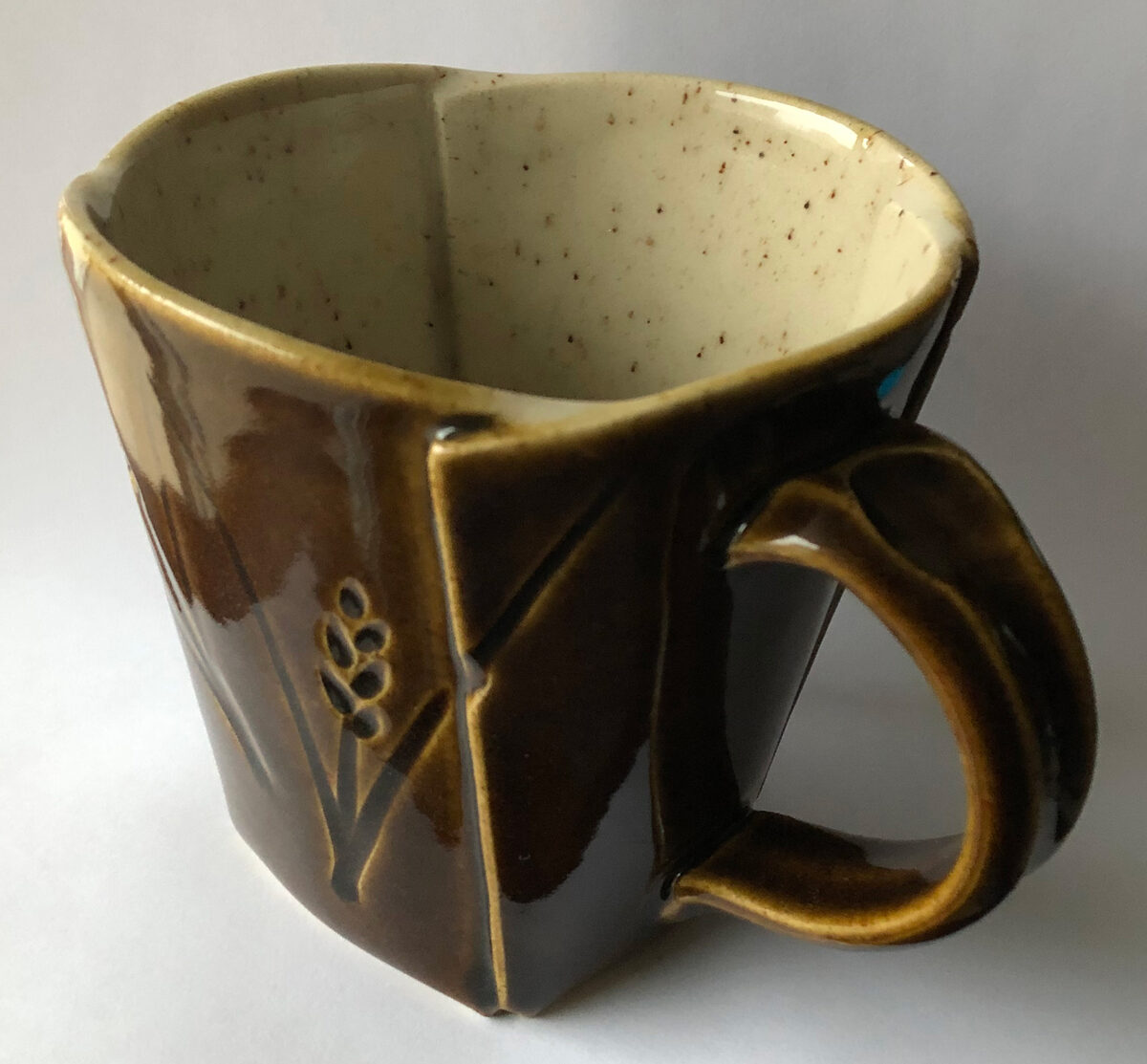 A mug made of manganese speckled clay