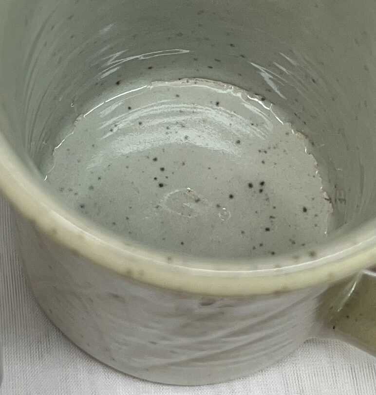 A glaze crawling inside a mug