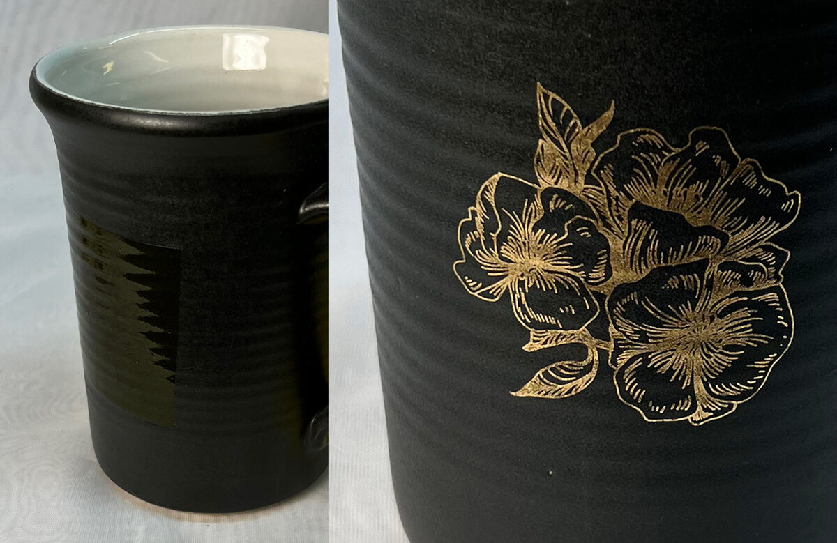 Black mug with gold flower