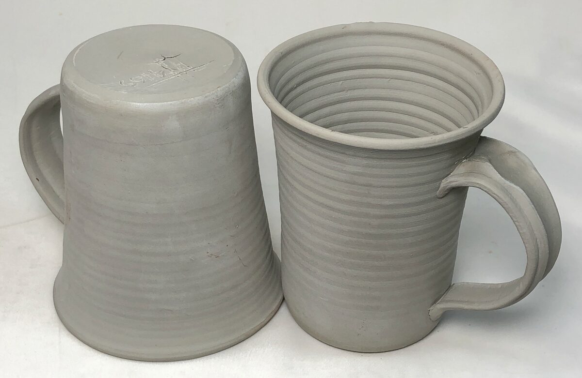 Two dried pottery mugs