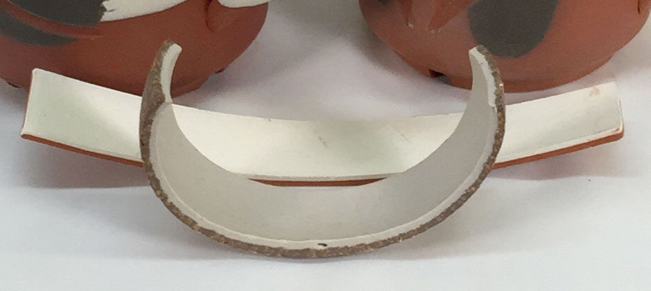 Porcelain engobe misfit on stoneware