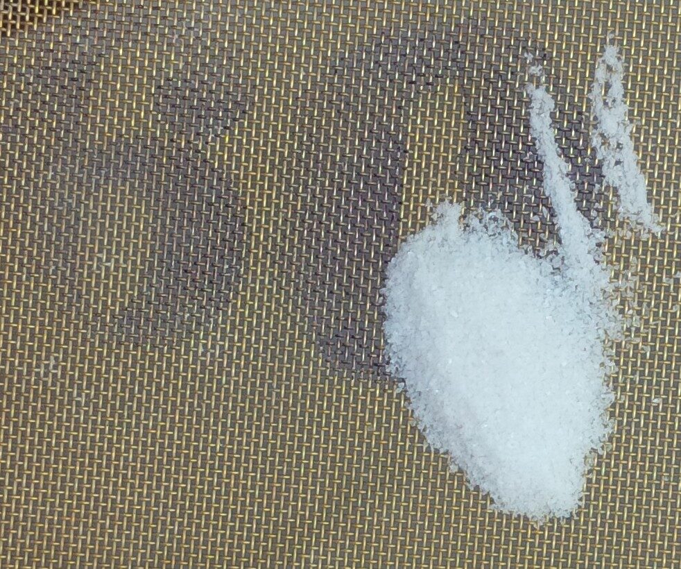 Salt on a 60 mesh sieve, some goes through some does not