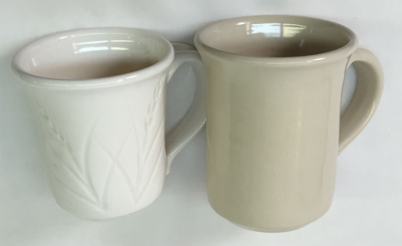 Side by side mugs, a porcelain made using only kaolin and one made with ball clay