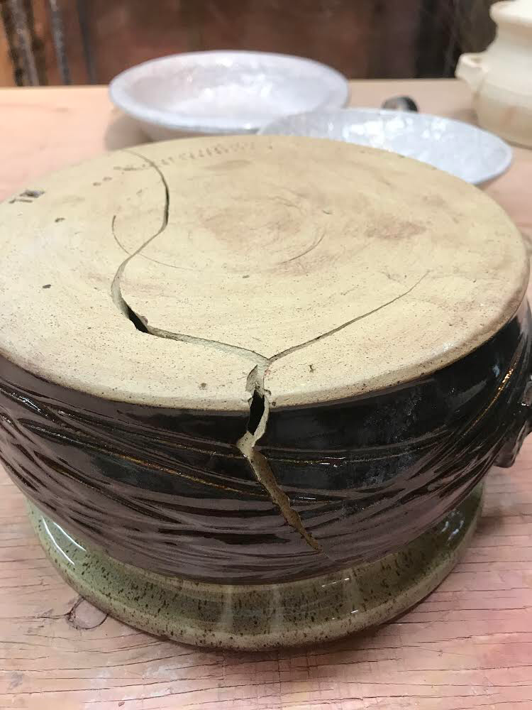 An upside down cracked casserole dish