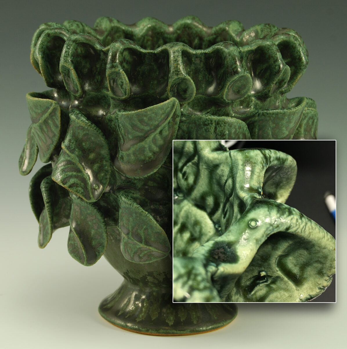 A copper sculpture glaze is blistering